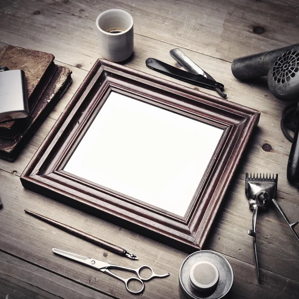 Tools of a barber with picture frame — Stock Photo, Image