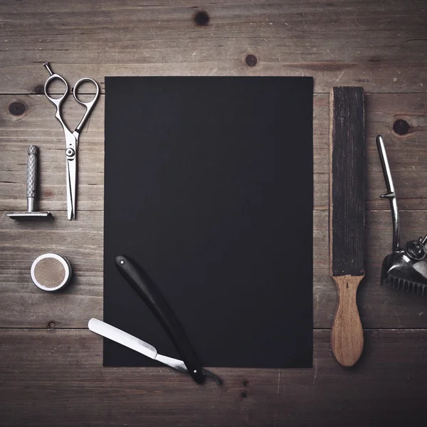 Barber tools and black page — Stock Photo, Image