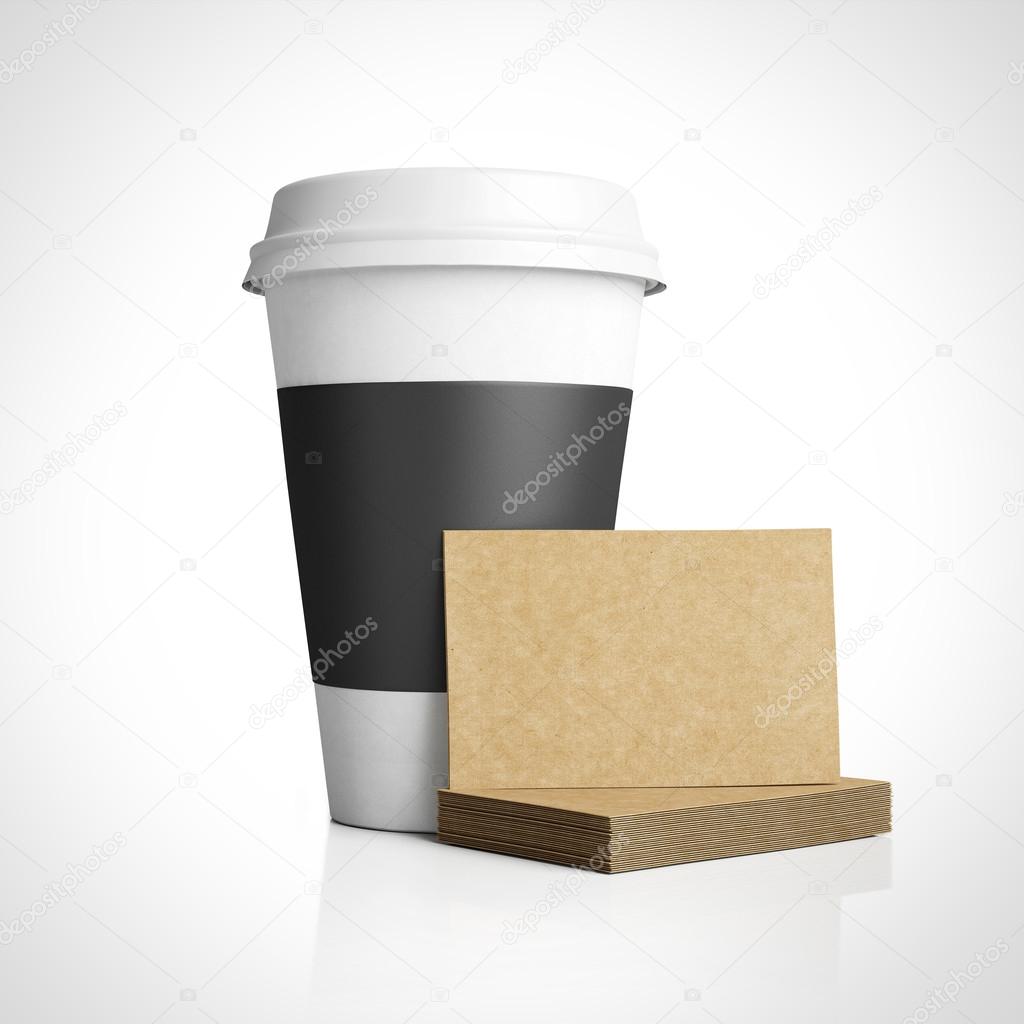 Business cards near paper cup