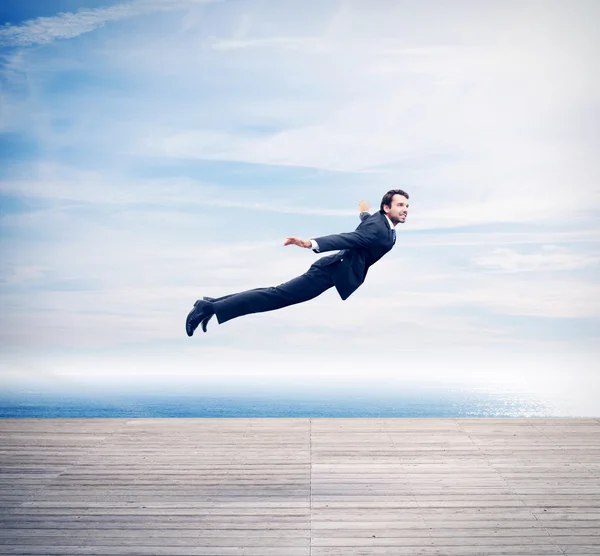 Man in suit flying — Stock Photo, Image