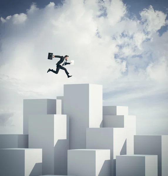 Businessman jumping on a cube. 3d rendering — Stock Photo, Image