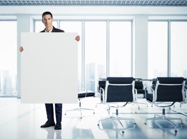 Businessman with white canvas  clipart