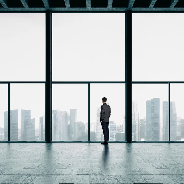 Businessman looking at the city — Stock Photo, Image