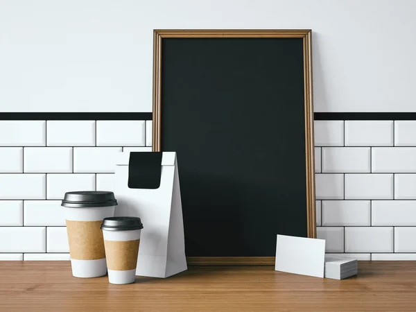 Zwarte poster op tafel met witte elementen — Stockfoto