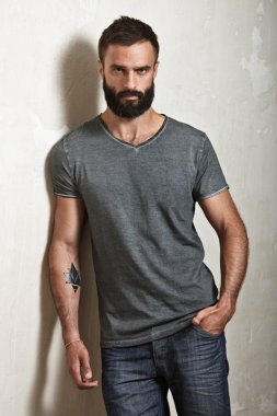 Bearded man wearing grey t-shirt