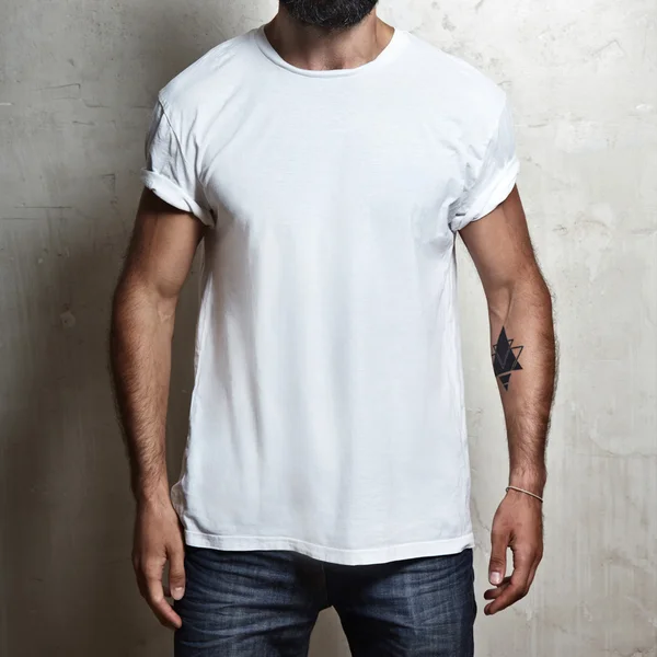 Muscular guy wearing white t-shirt — Stock Photo, Image