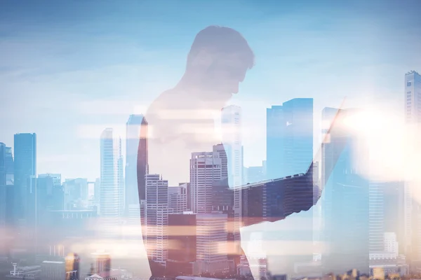 Double exposure of man with laptop on the background — Stock Photo, Image