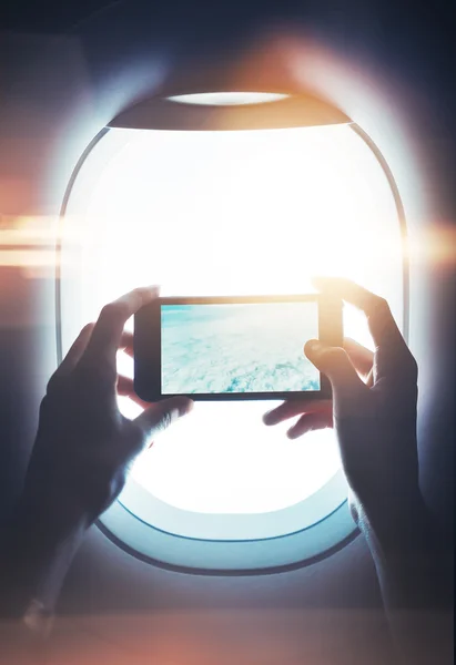 Mock up of girl handing smartphone in hands and making photo