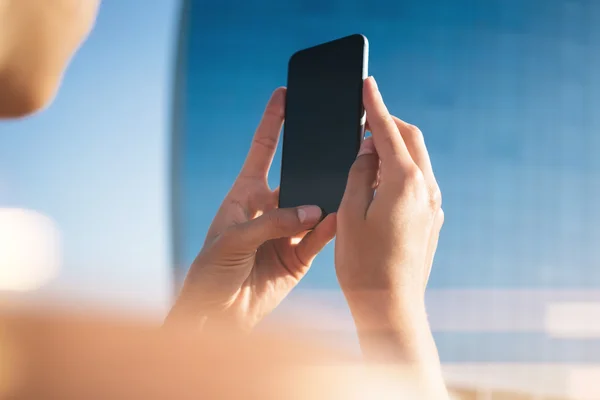 Mock up of girl making photo on her smartphone — Stock Photo, Image