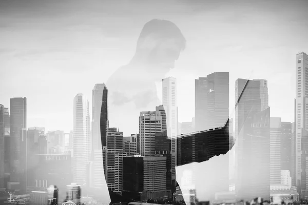 Double exposure of young man with laptop on the background — Stock Photo, Image