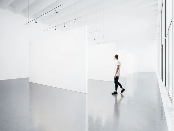 Gallery interior and young man — Stock Photo, Image