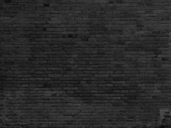 Parte da parede de tijolo pintado de preto — Fotografia de Stock