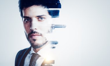 Portrait of young businessman and contemporary city on the background. Double exposure.
