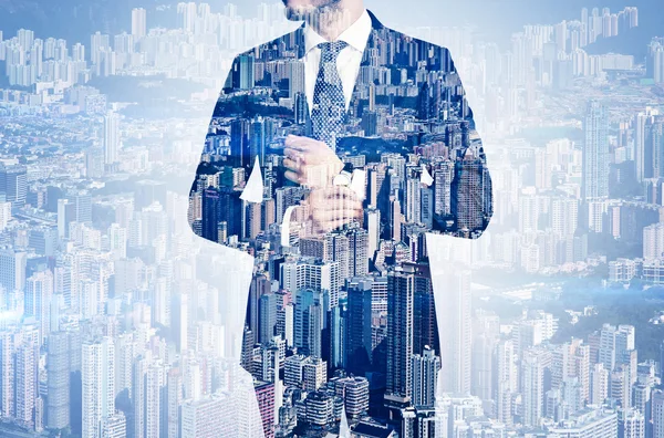 Multi exposure of young business man in the skyscraper on background — Stock Photo, Image