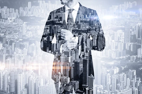 Bw multi exposure of young business man in the skyscraper on background — Stock Photo, Image