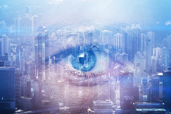 Close-up of human eye with visual effects and double exposure  contemporary city on the background. Horizontal — Zdjęcie stockowe