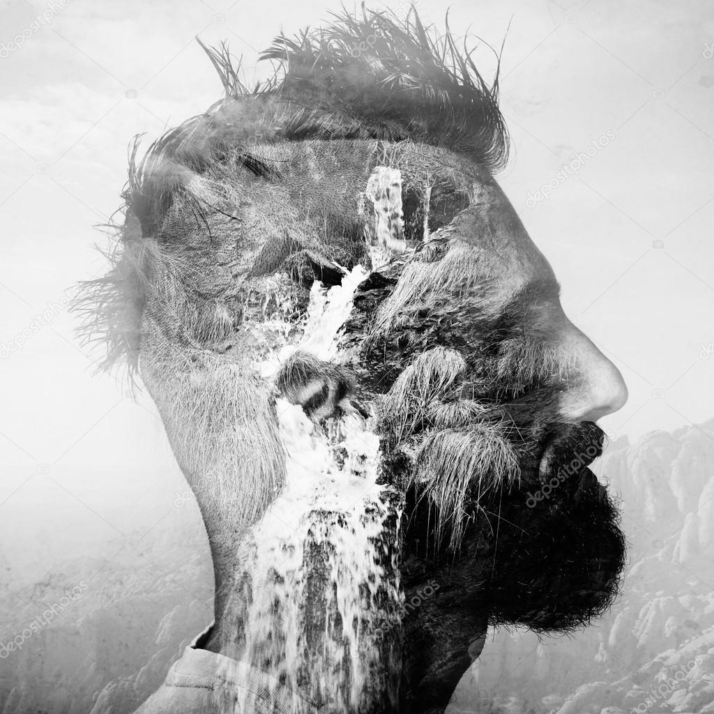 BW double exposure portrait of a man with mohawk and amountain