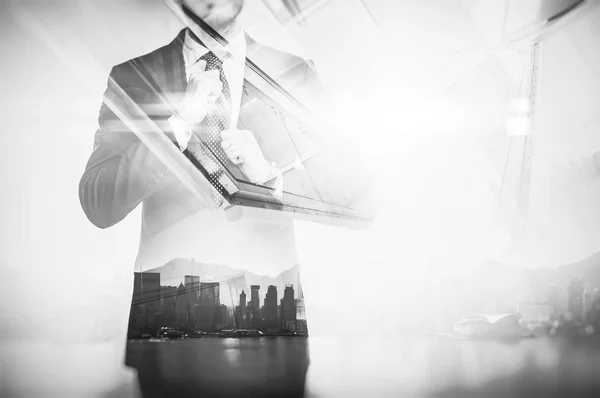 Close-up portrait of businessman straightens his own tie. Double exposure city at sunrise — Stock Photo, Image