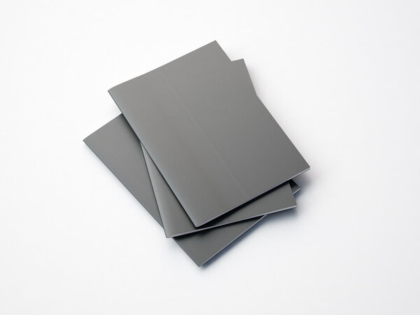 Set of gray notebooks on the white background. 3d render