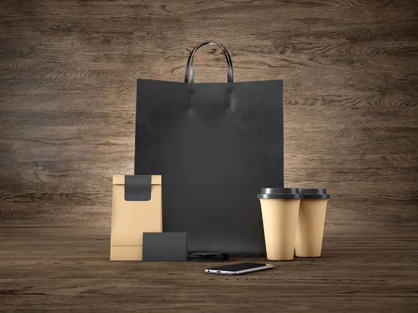 검은 쇼핑백, 2 개의 갈색 커피 컵, 빈 비즈니스 카드 및 일반 디자인 스마트폰 집합입니다. 나무 배경입니다. 3d 렌더링 — 스톡 사진