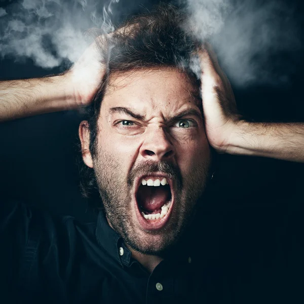 Guy who grabs his head in hands — Stock Photo, Image