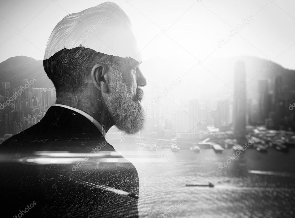 bearded businessman and contemporary city
