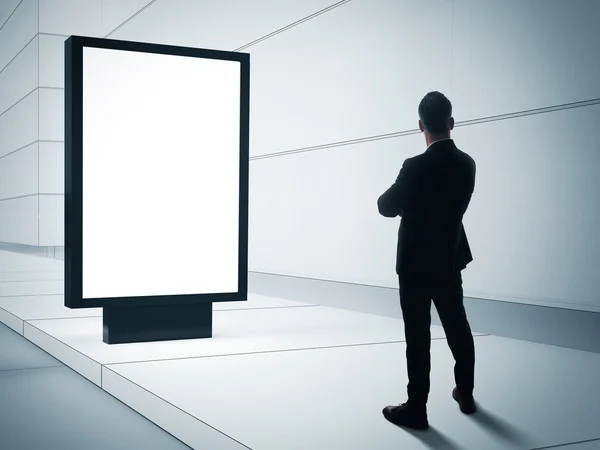 Hombre mirando caja de luz en blanco —  Fotos de Stock