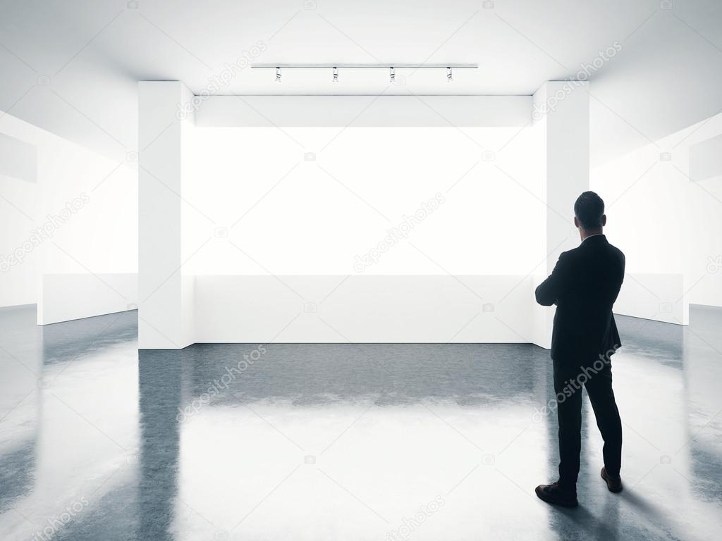 man looking at empty screen