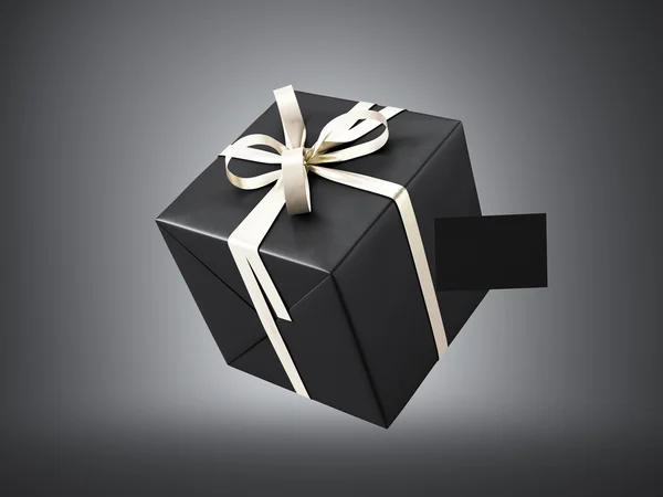 Black gift box with golden ribbon — Stock Photo, Image