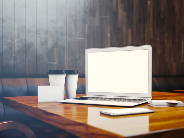 Conjunto de portátiles de diseño genérico, tarjetas de visita, teléfonos inteligentes y tazas de café en blanco en la mesa en el interior moderno en el fondo. 3d renderizar —  Fotos de Stock