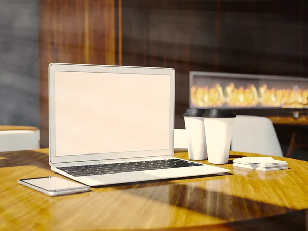 Set laptop desain generik, kartu bisnis, smartphone dan cangkir kopi kosong di atas meja di interior restoran modern. Horisontal. render 3d — Stok Foto