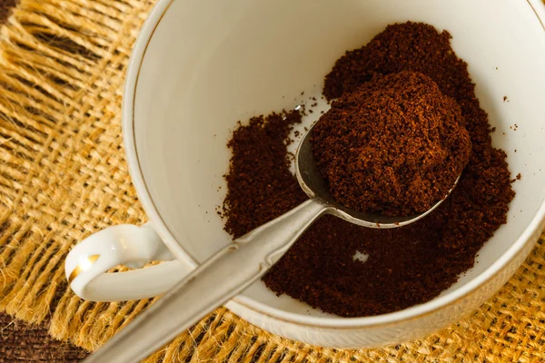 Ground coffee in a spoon — Stock Photo, Image