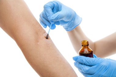 Nurse applying  iodine