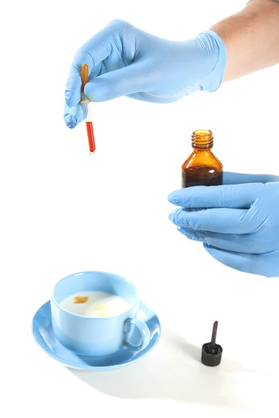 Doctor Hands with liquid in glassware — Stock Photo, Image