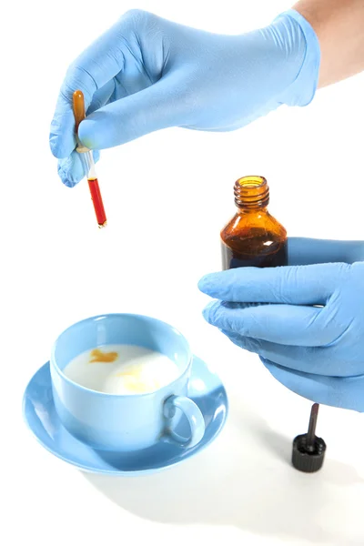 Doctor Hands with liquid in glassware — Stock Photo, Image