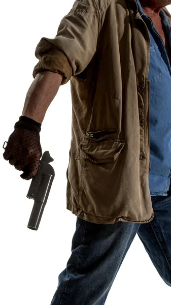 Человек в черной перчатке с пистолетом — стоковое фото