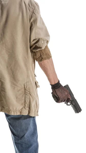 Man in black glove with a gun — Stock Photo, Image