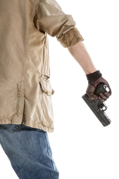 Mann in schwarzem Handschuh mit Waffe — Stockfoto