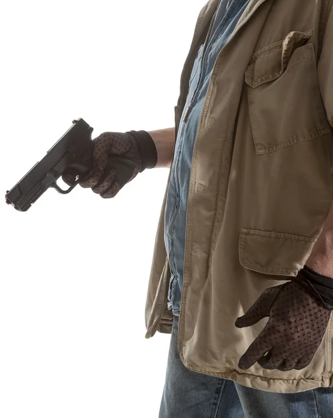 Mann mit schwarzen Handschuhen und Pistole — Stockfoto