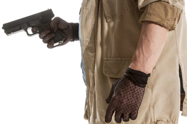 Mann mit schwarzen Handschuhen und Pistole — Stockfoto