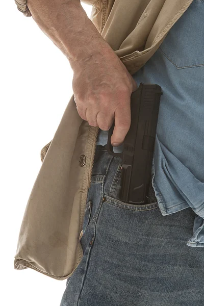 Seorang pria menarik pistol keluar dari sakunya — Stok Foto