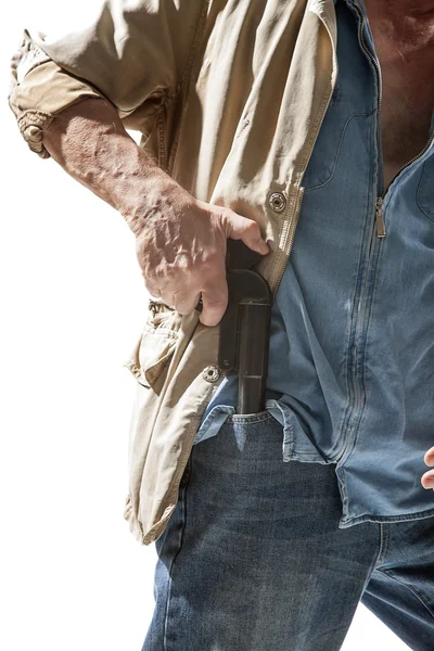Seorang pria menarik pistol keluar dari sakunya — Stok Foto