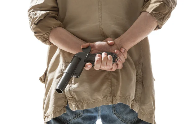Hombre escondiendo arma detrás de su espalda —  Fotos de Stock