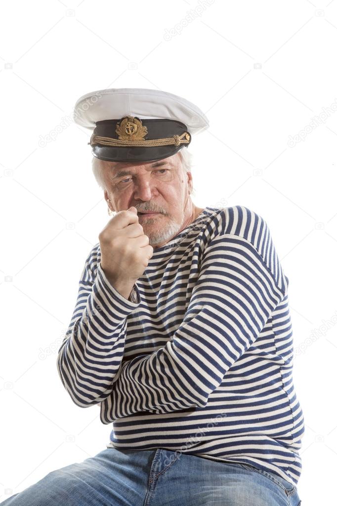 Old sailor man smokes pipe