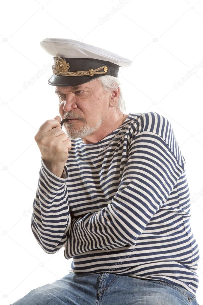 Old sailor man smokes pipe