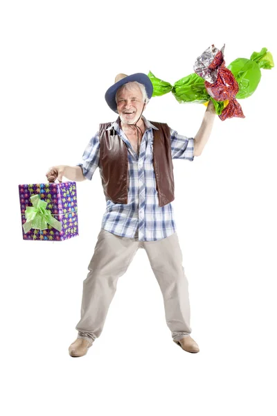 Senior man with candies and gift bag — Stock Photo, Image