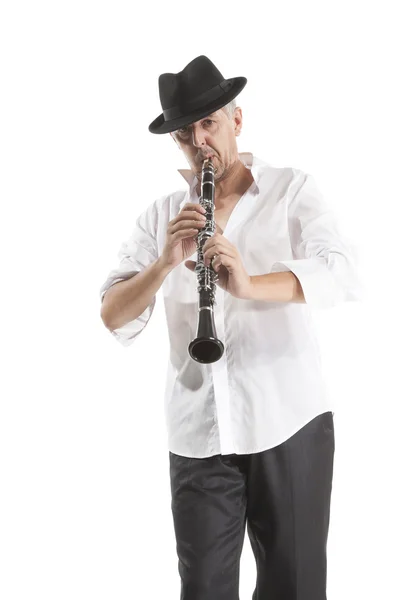 Man in hat playing clarinet — Stock Photo, Image