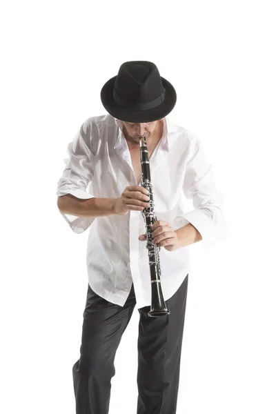 Man in hat playing clarinet — Stock Photo, Image