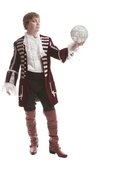Homem em roupas medievais com bola decorativa — Fotografia de Stock