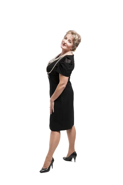 Middle-aged woman in black dress. — Stock Photo, Image